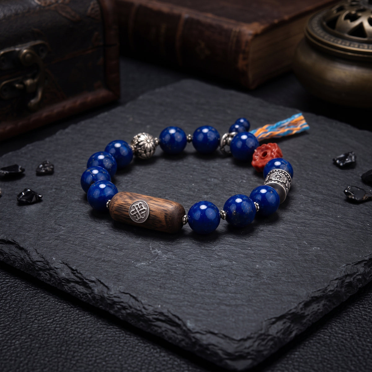 Lapis lazuli beaded Tibetan bracelet with carved wooden barrel and silver spacers