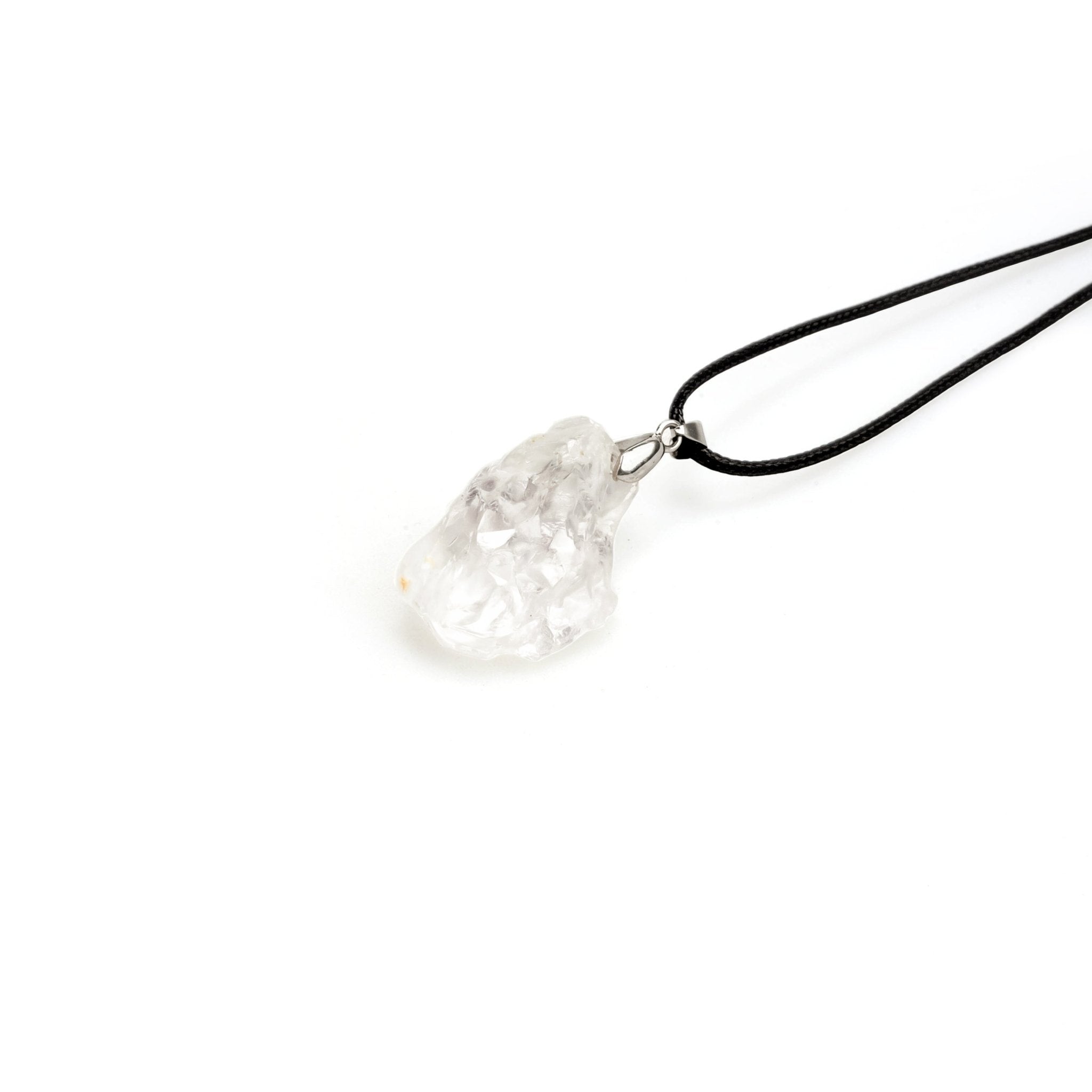 Clear quartz rough stone pendant with silver bail on black cord