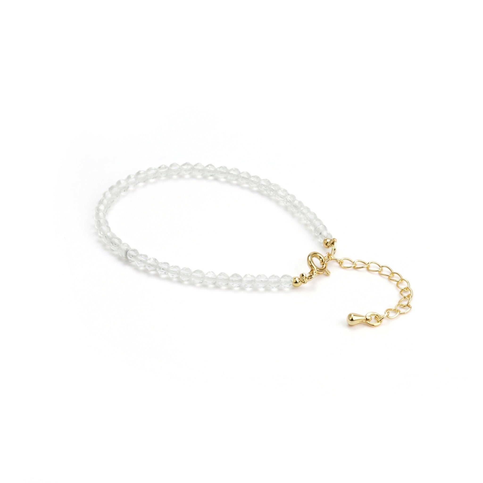 Clear quartz crystal bead bracelet, gold toggle clasp with short chain drop