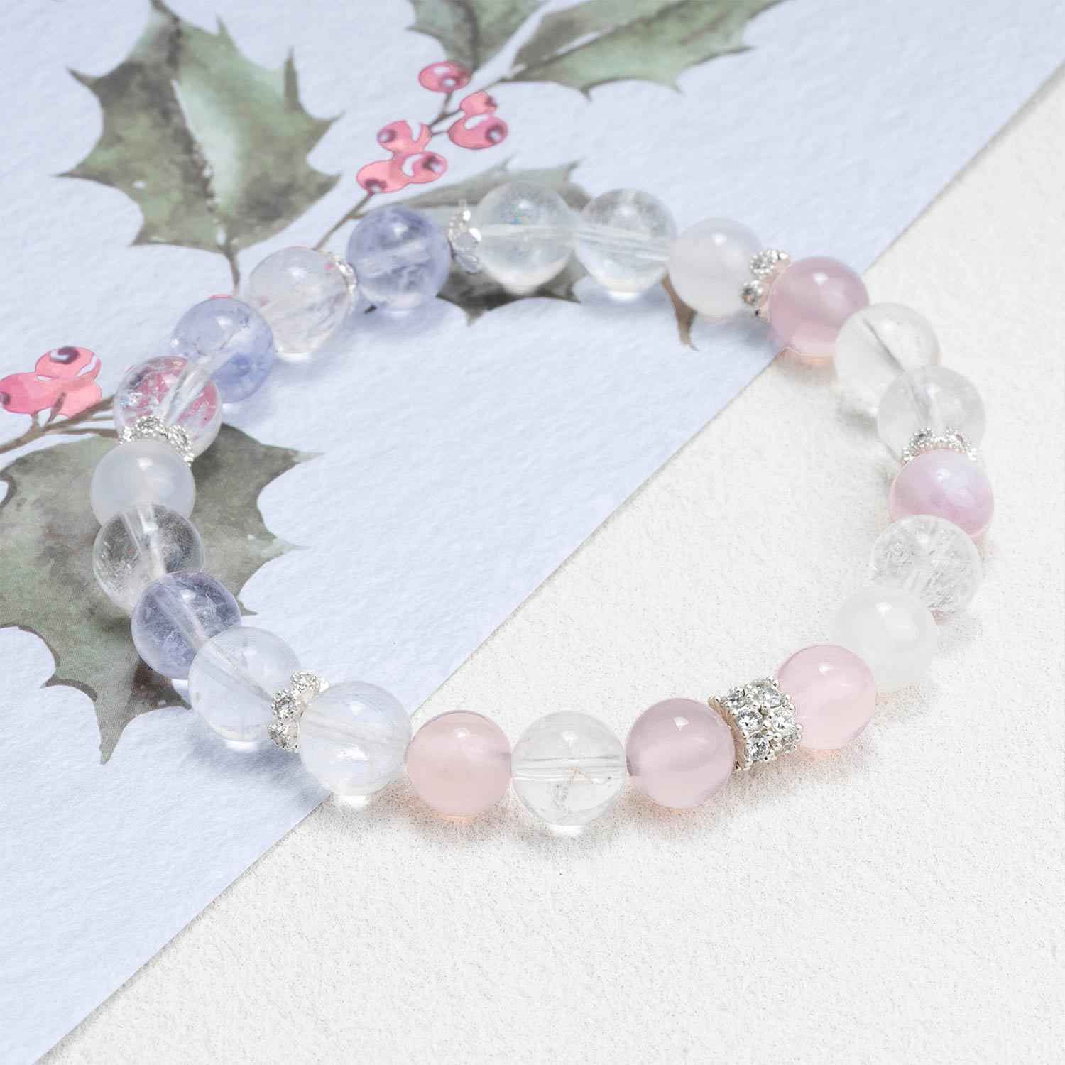 Crystal bead bracelet with translucent lavender and clear beads, pink accents, silver charm