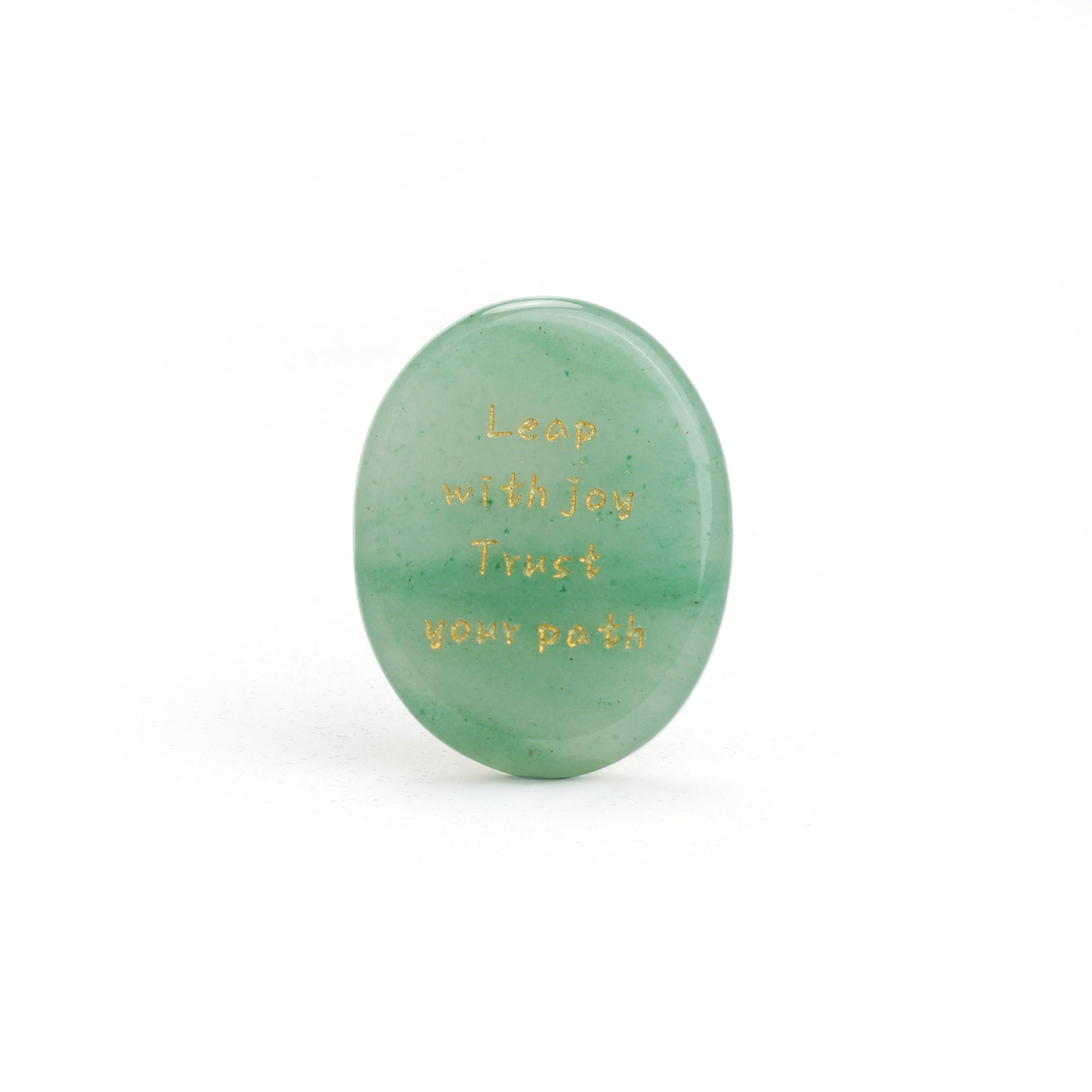 Translucent oval green stone with gold engraved wording
