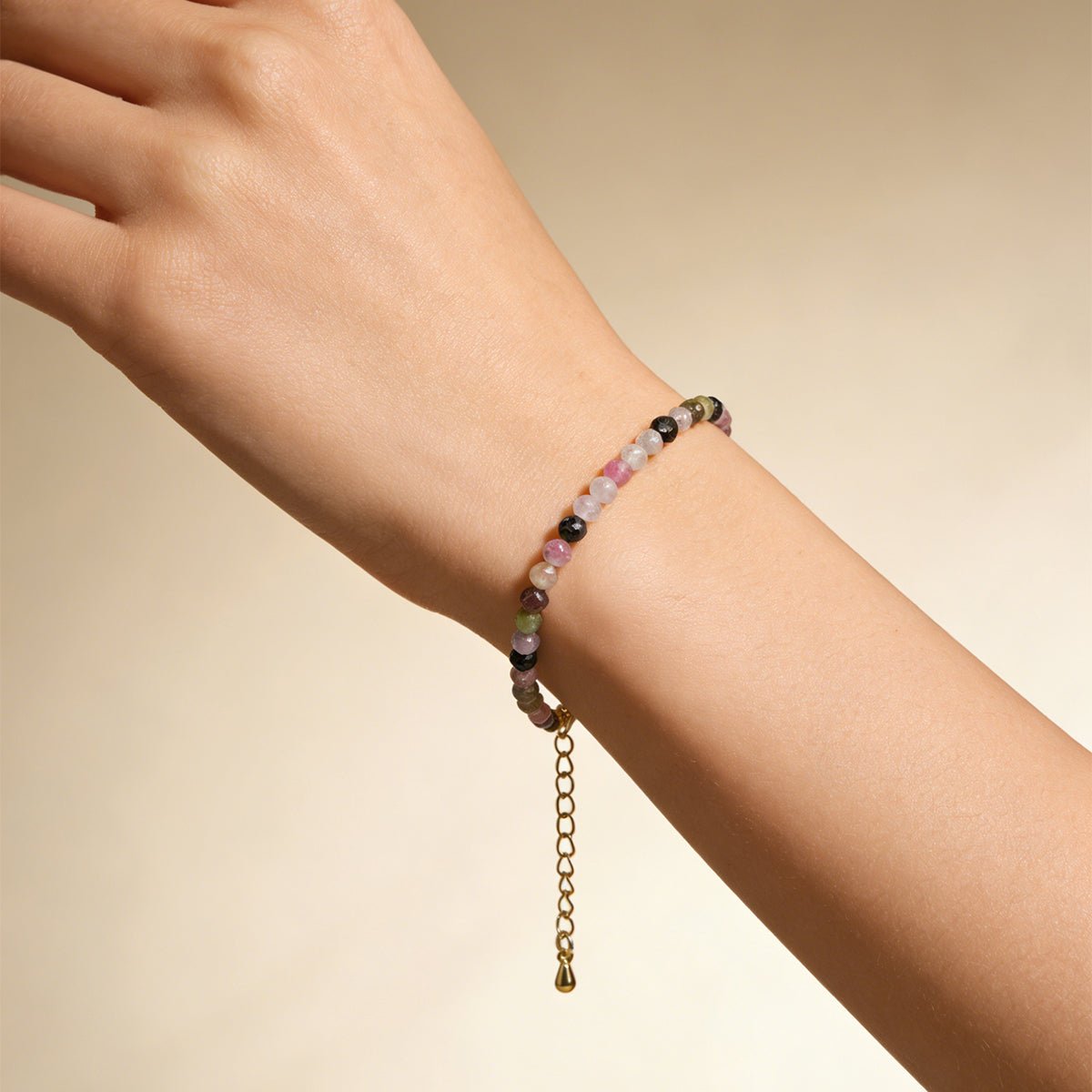 Rainbow tourmaline crystal bracelet with gold chain drop and multicolor beads