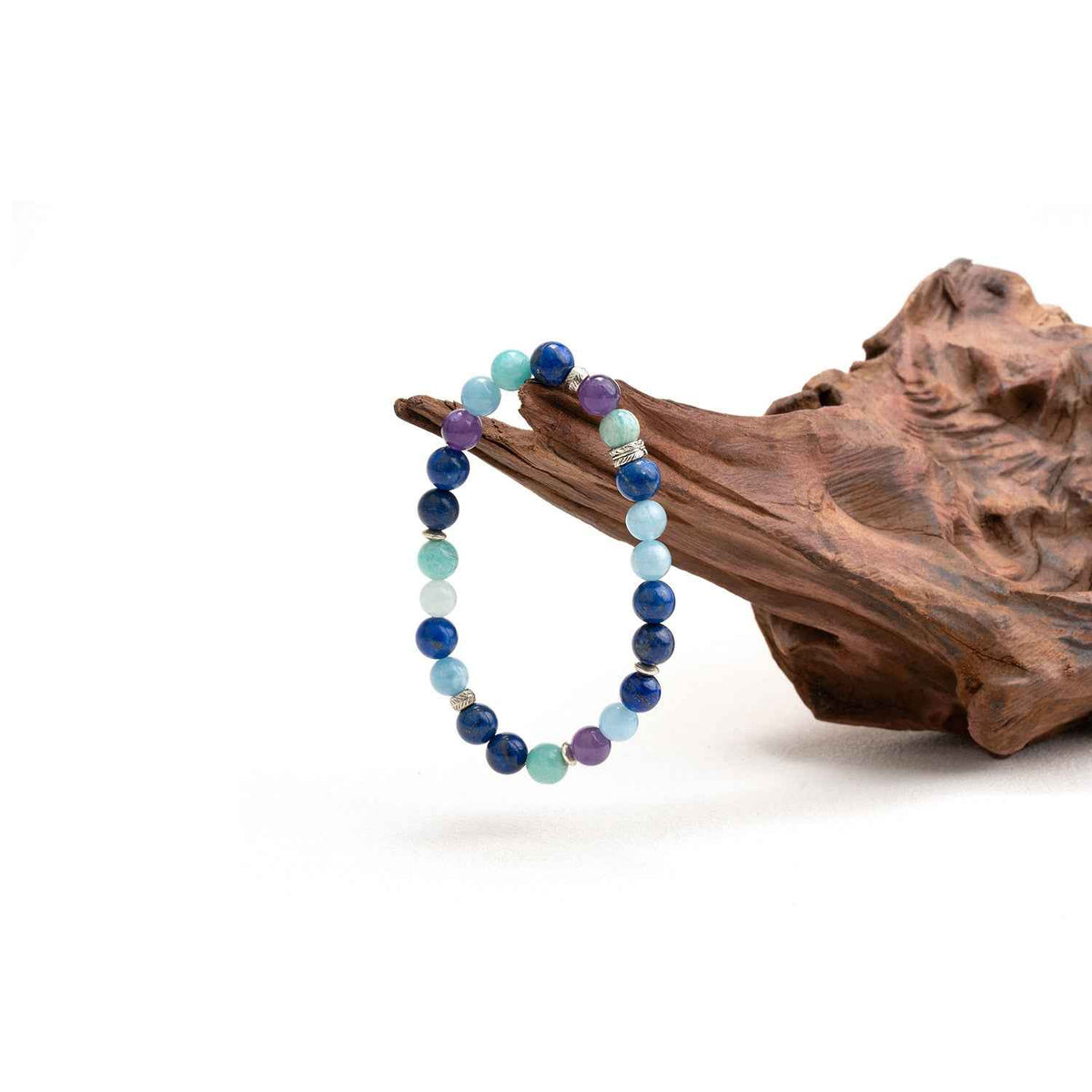 Crystal beaded bracelet with navy, light blue, purple, and teal round stones on a string