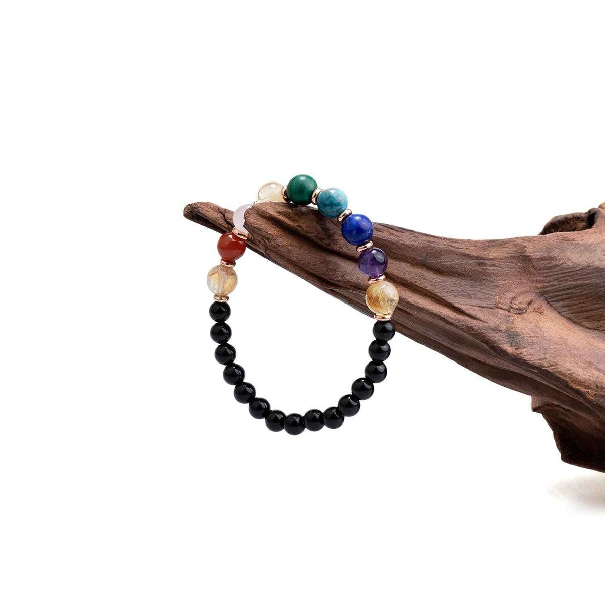 Crystal bead bracelet with black beads and blue, teal, and rose-gold accent stones