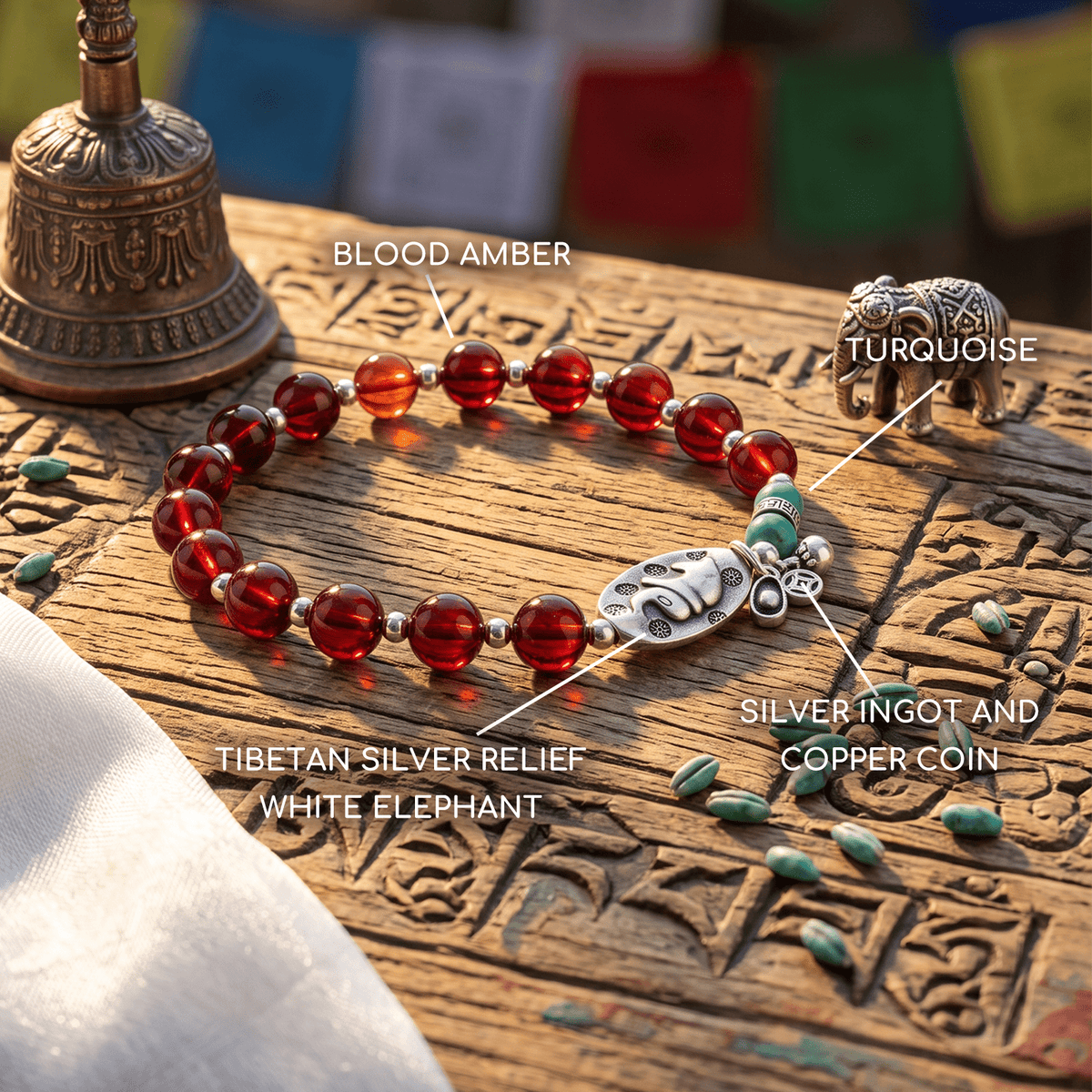 Red amber bead bracelet with silver elephant relief and turquoise bead accents