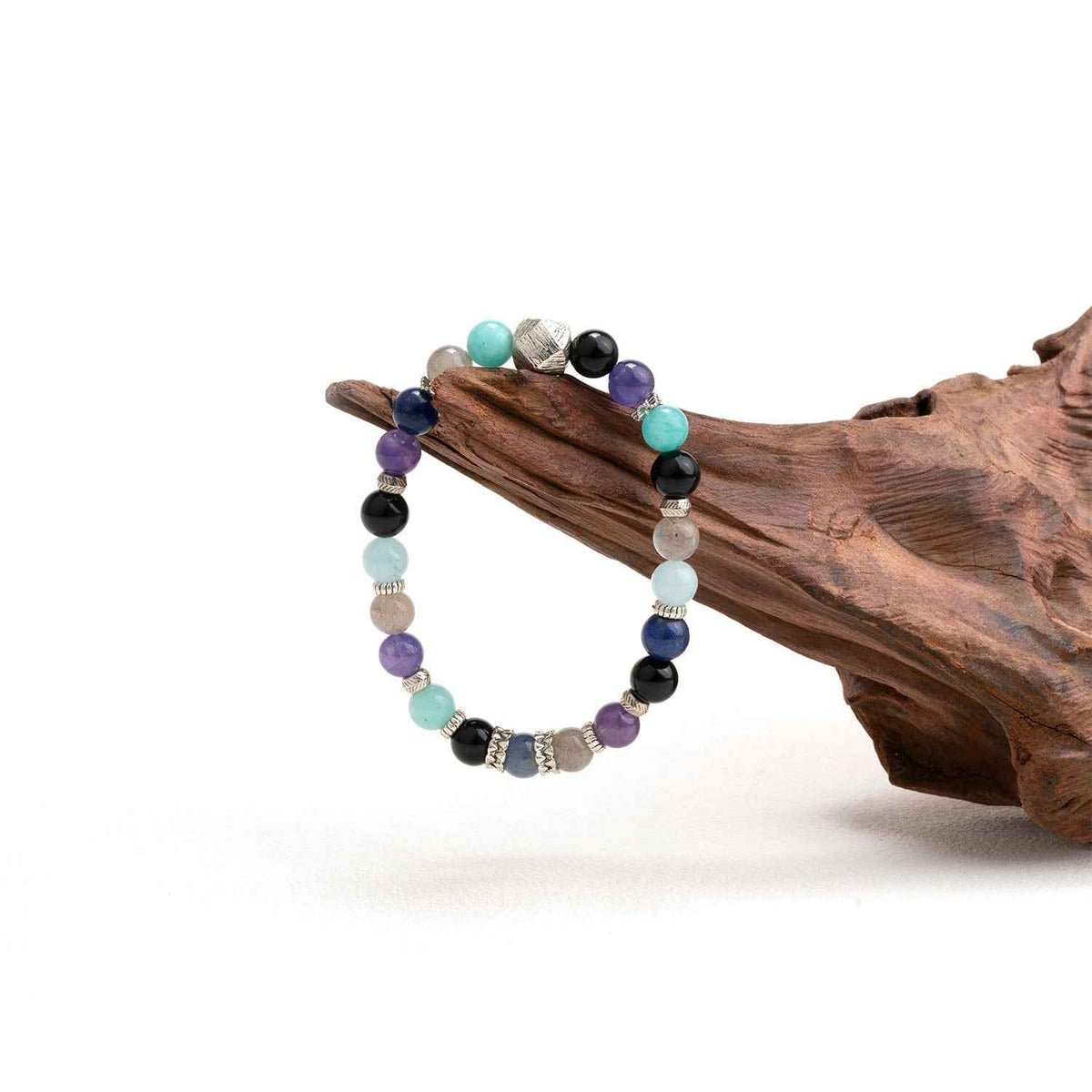 Crystal bead bracelet with purple, black, aqua, and blue stones and silver spacer beads