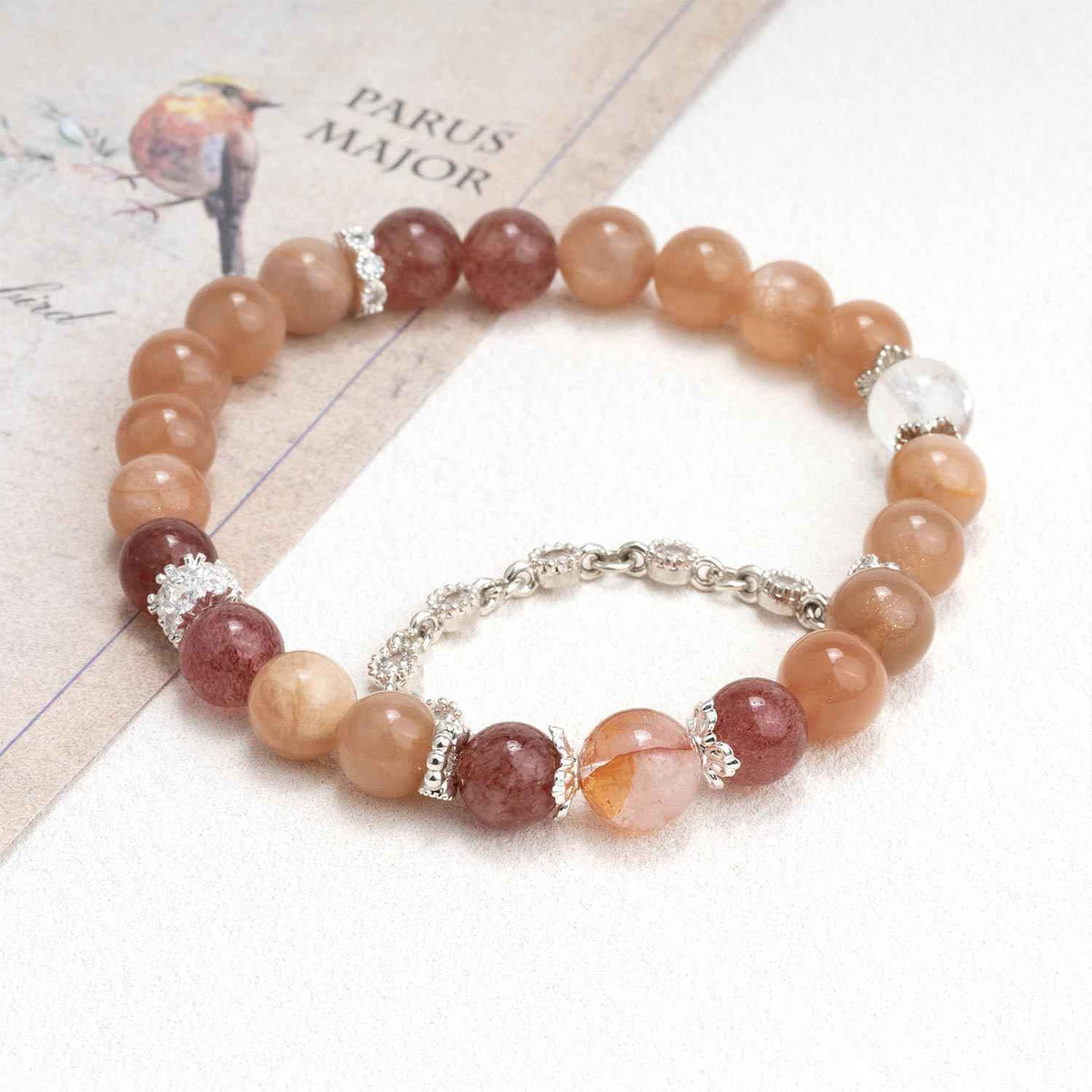 Intimate crystal bracelet with peach and rose beads, silver spacers, linked charm