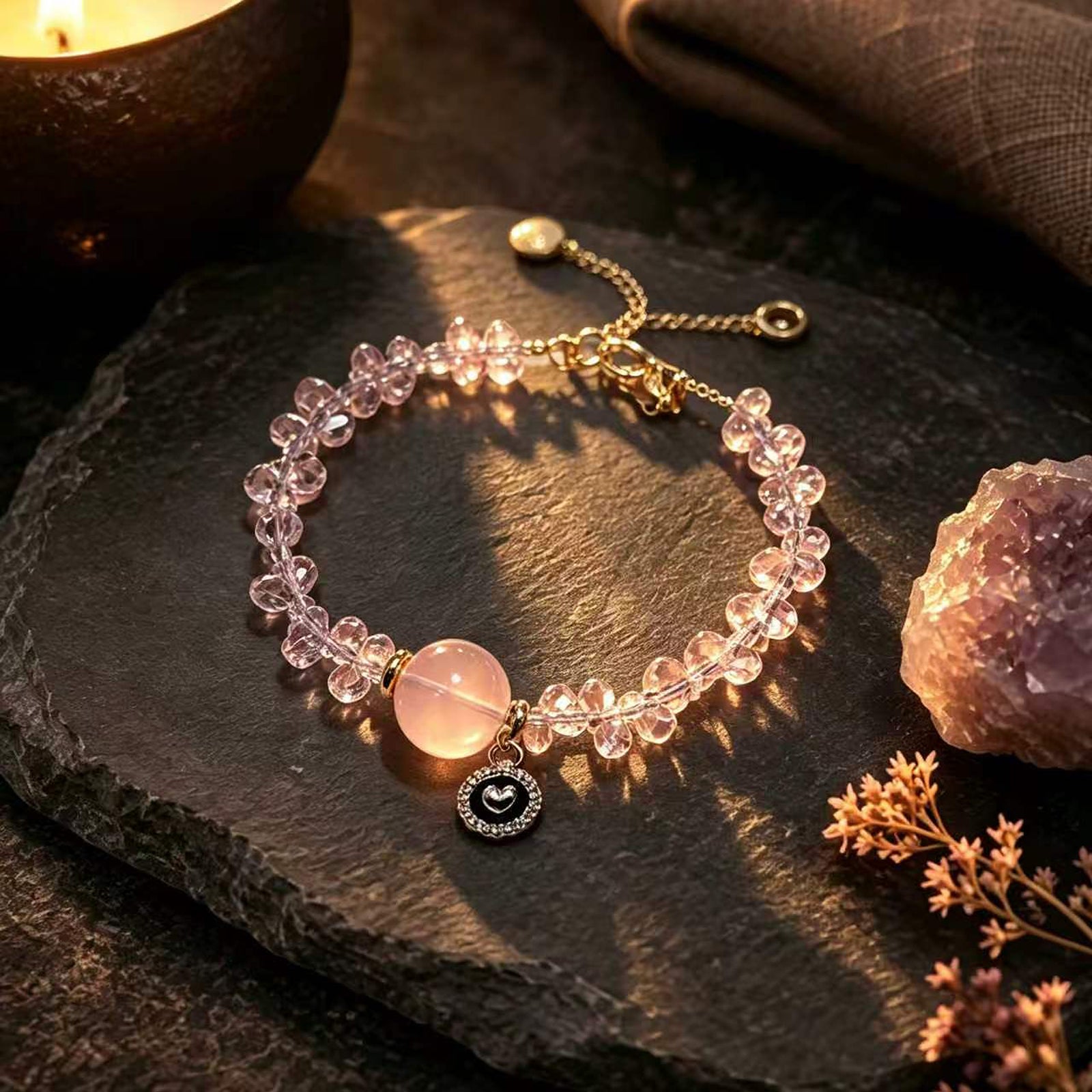 Rose-pink beaded bracelet with round pink cabochon stone and small eye charm