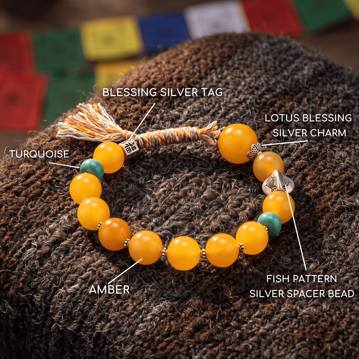 Tassel bead bracelet with amber orange beads, turquoise accents, and silver charm details