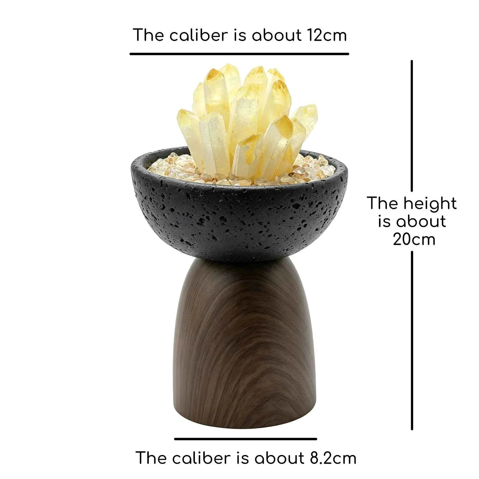 Aroma pot with black speckled bowl, wooden stand, and yellow crystal cluster