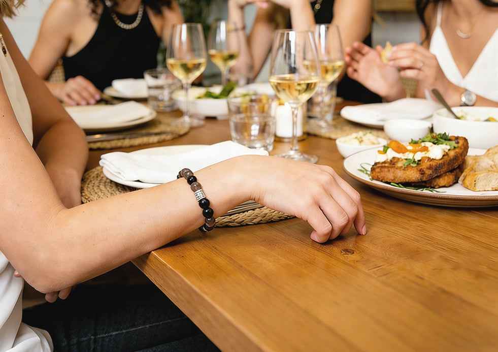 Crystal bracelet worn during casual dining with friends - crystal jewelry in everyday social settings