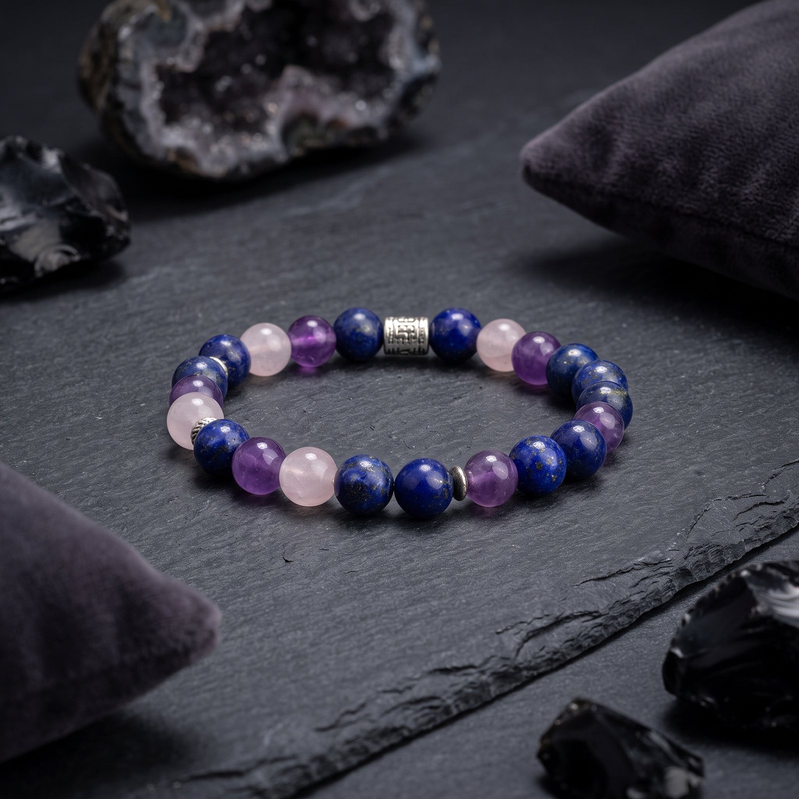 Beaded crystal bracelet with blue and purple round stones and silver-tone charm