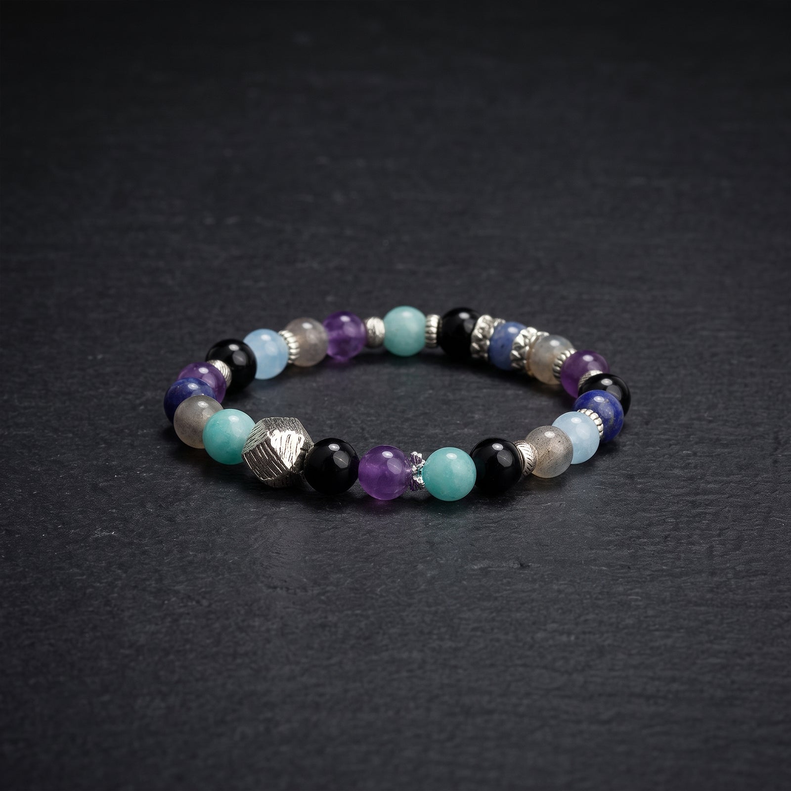 Multicolor 7-chakra healing crystal bracelet with silver spacers and engraved black beads