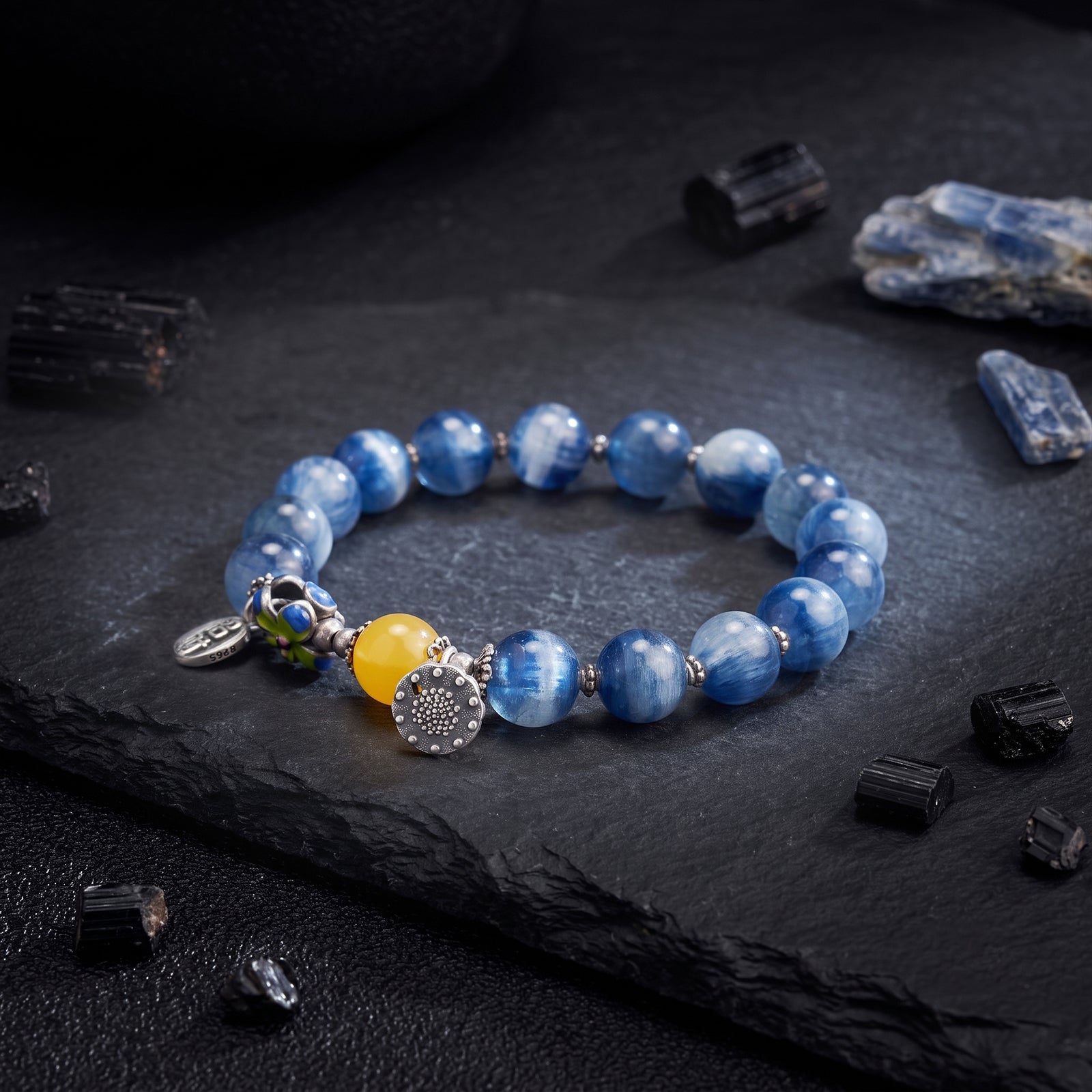 Blue beaded crystal bracelet with silver charm and yellow focal bead