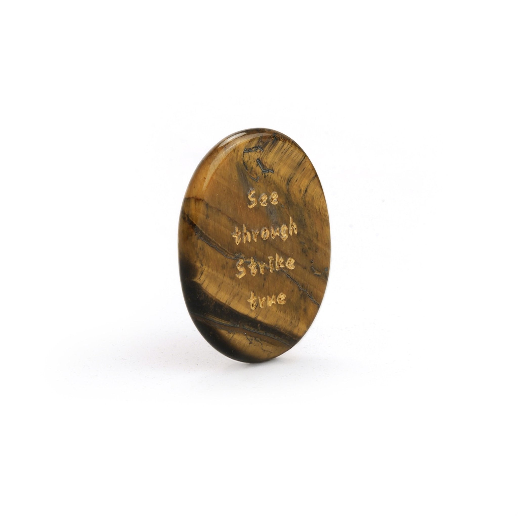 Oval tiger’s eye stone, gold-brown with engraved words on the face