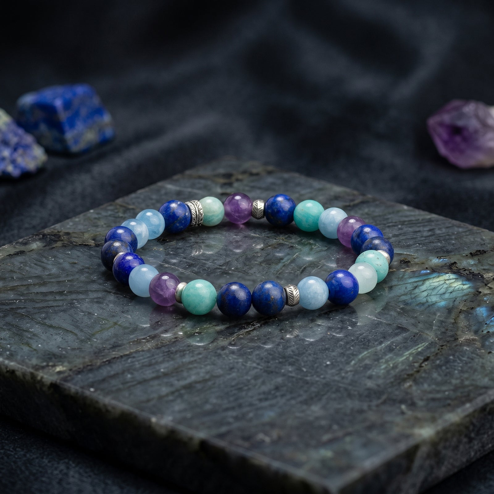 Multicolor crystal beaded bracelet with metal spacers, blue, purple, and aqua stones