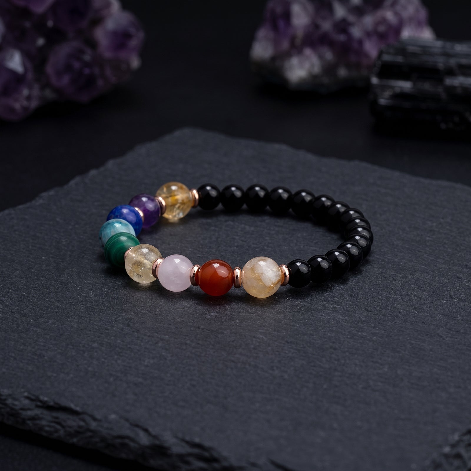 Beaded energy crystal bracelet with black round beads and multicolor gemstone spacers