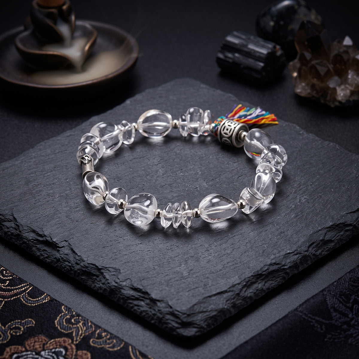 Clear quartz bead bracelet with round clear stones and multicolor tassel bead charm