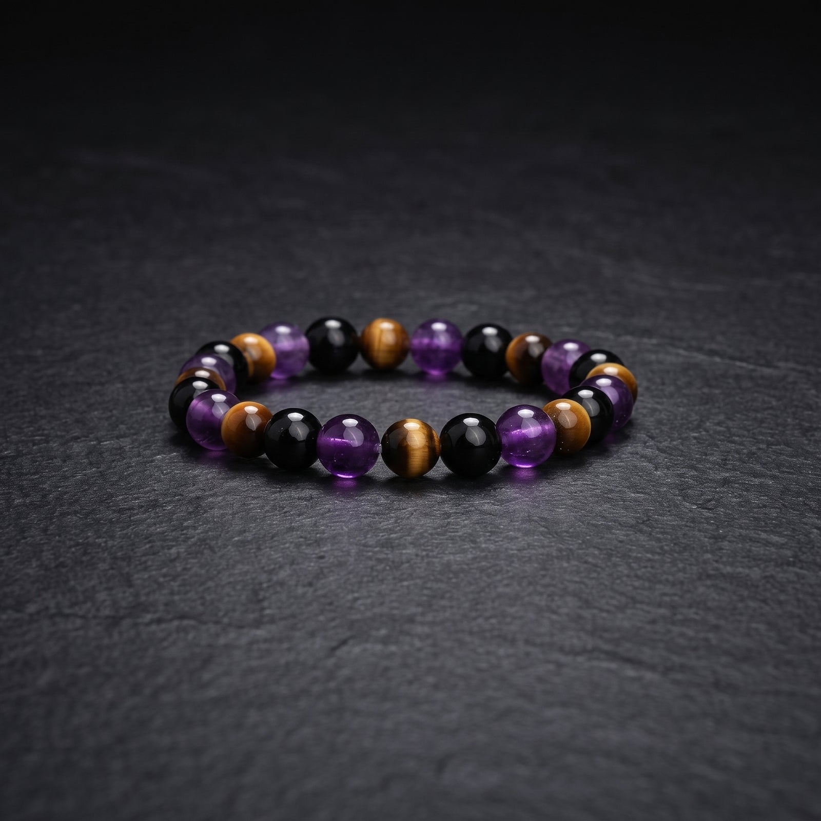 Crystal bead bracelet with purple, black, and brown round beads, stretch fit