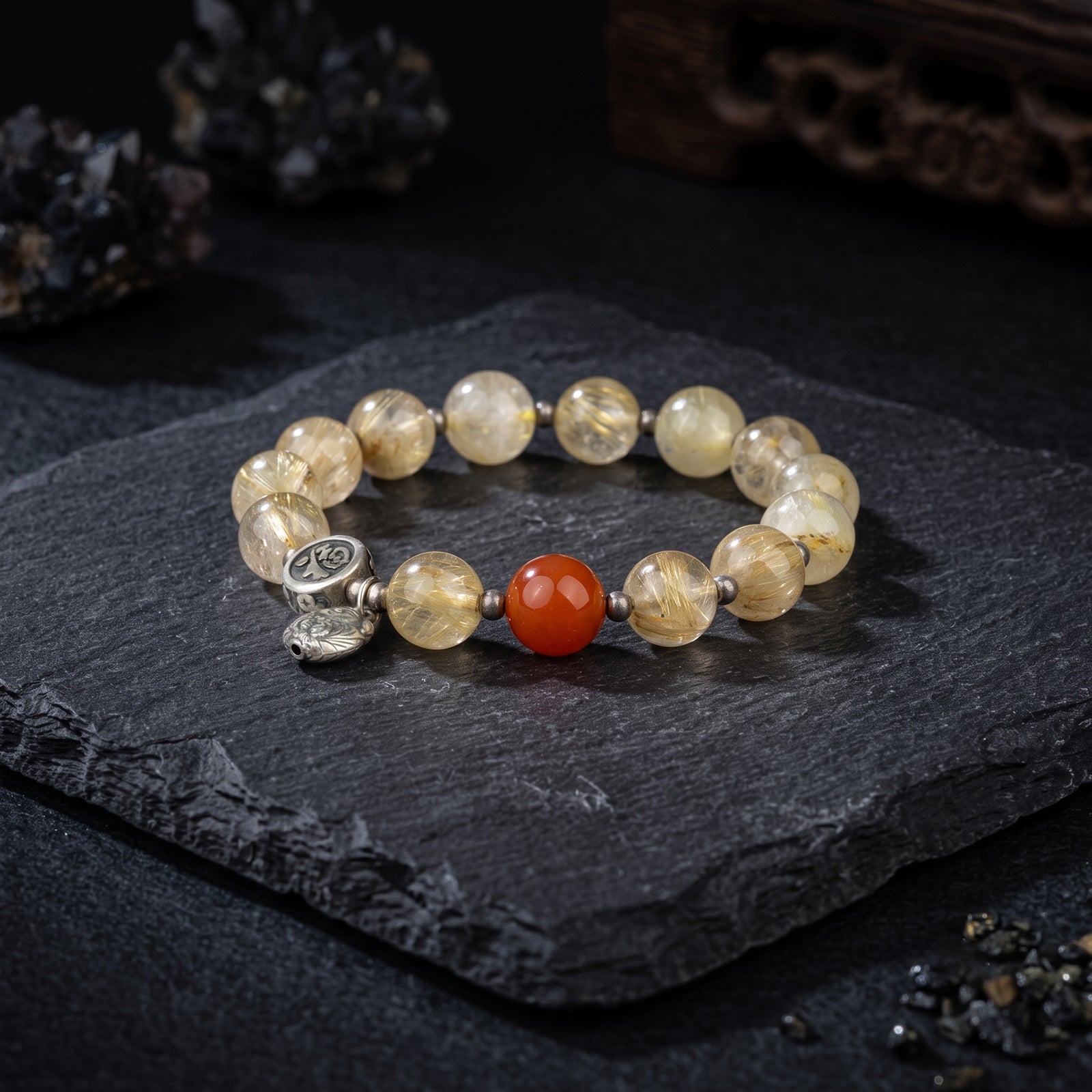 Golden quartz bracelet with red bead center and two silver coin charms