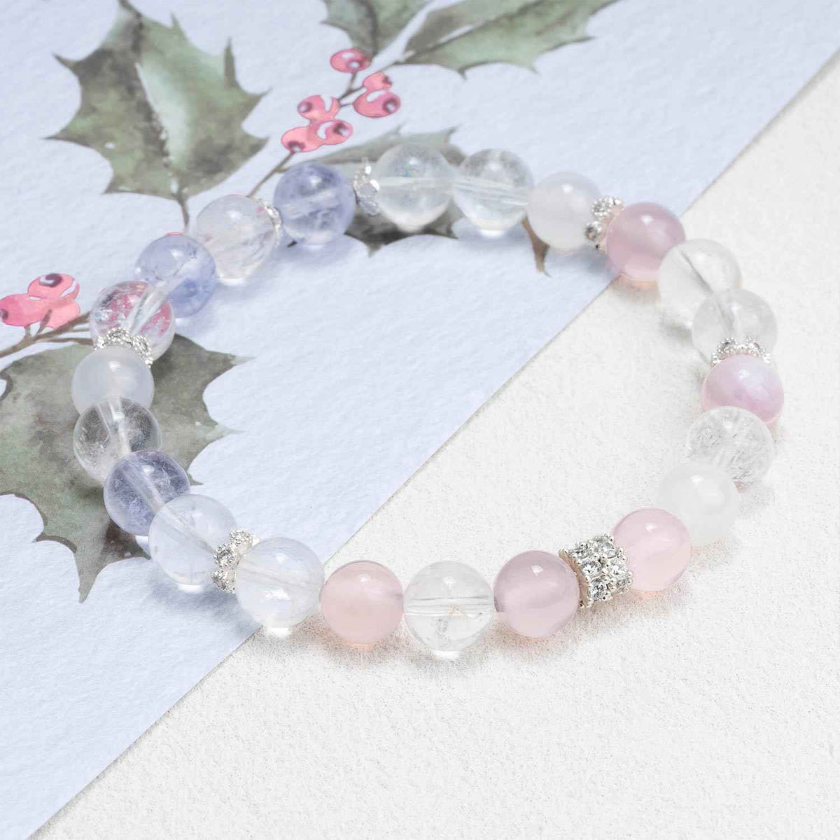 Crystal bead bracelet with translucent lavender and clear beads, pink accents, silver charm