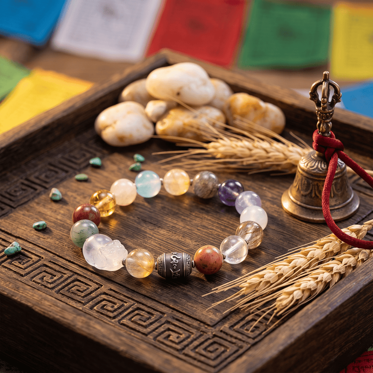 Multi-color crystal bracelet with round gemstone beads and carved mantra-style centerpiece