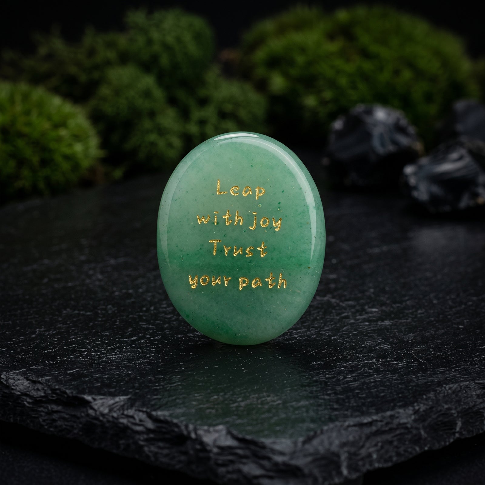 GROWTH-Aventurine oval green stone with carved quote across front, polished surface.