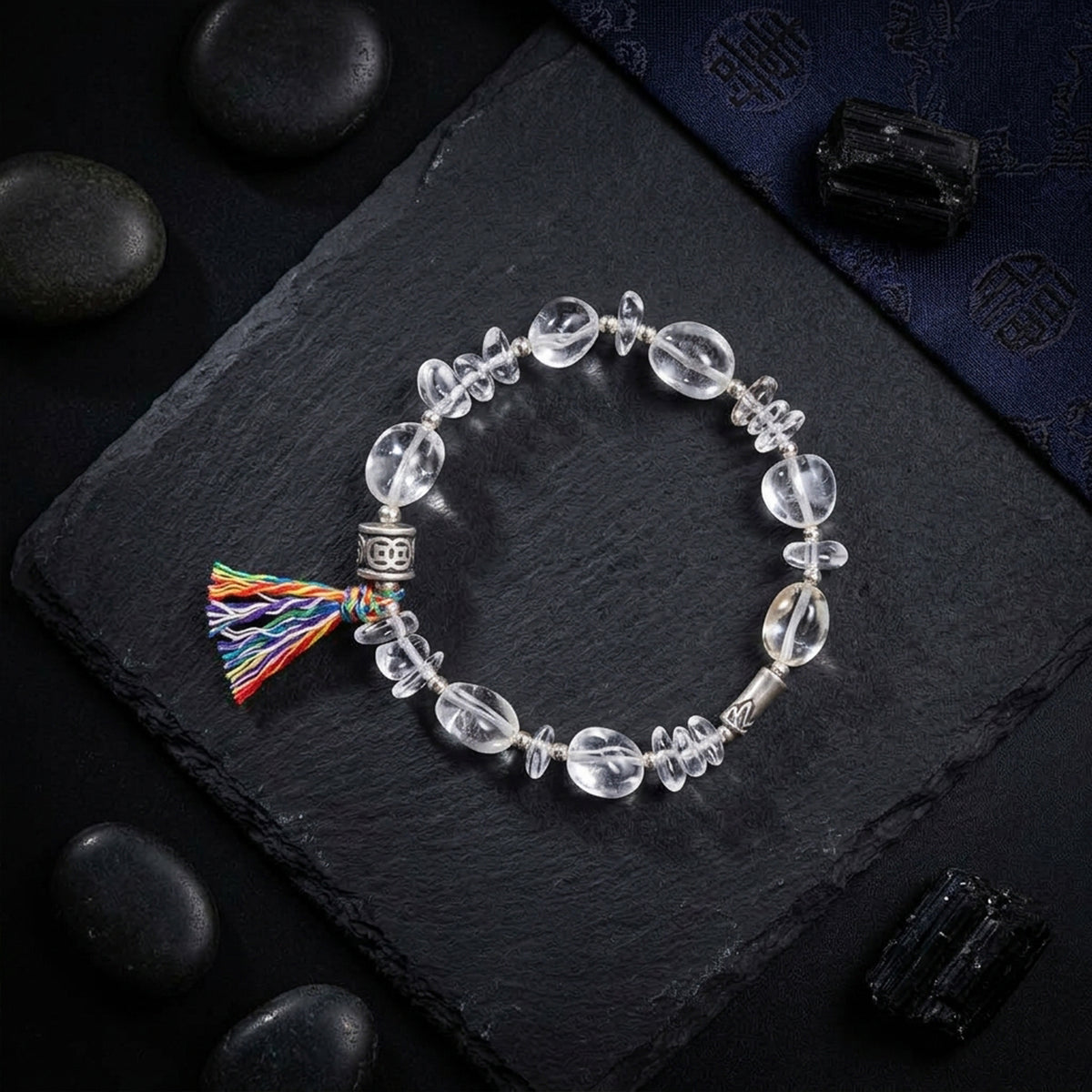 Clear quartz bead bracelet with multicolor tassel and Tibetan silver charm accents
