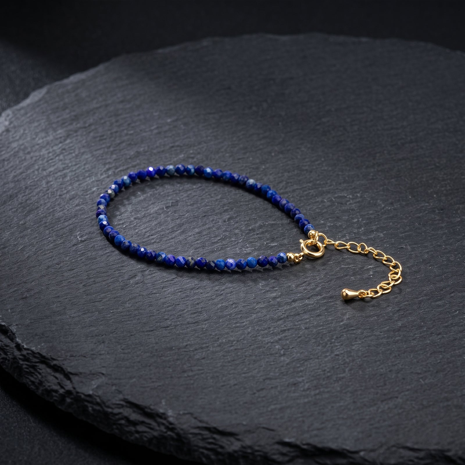 Lapis lazuli blue beaded bracelet with gold-tone clasp and chain extender