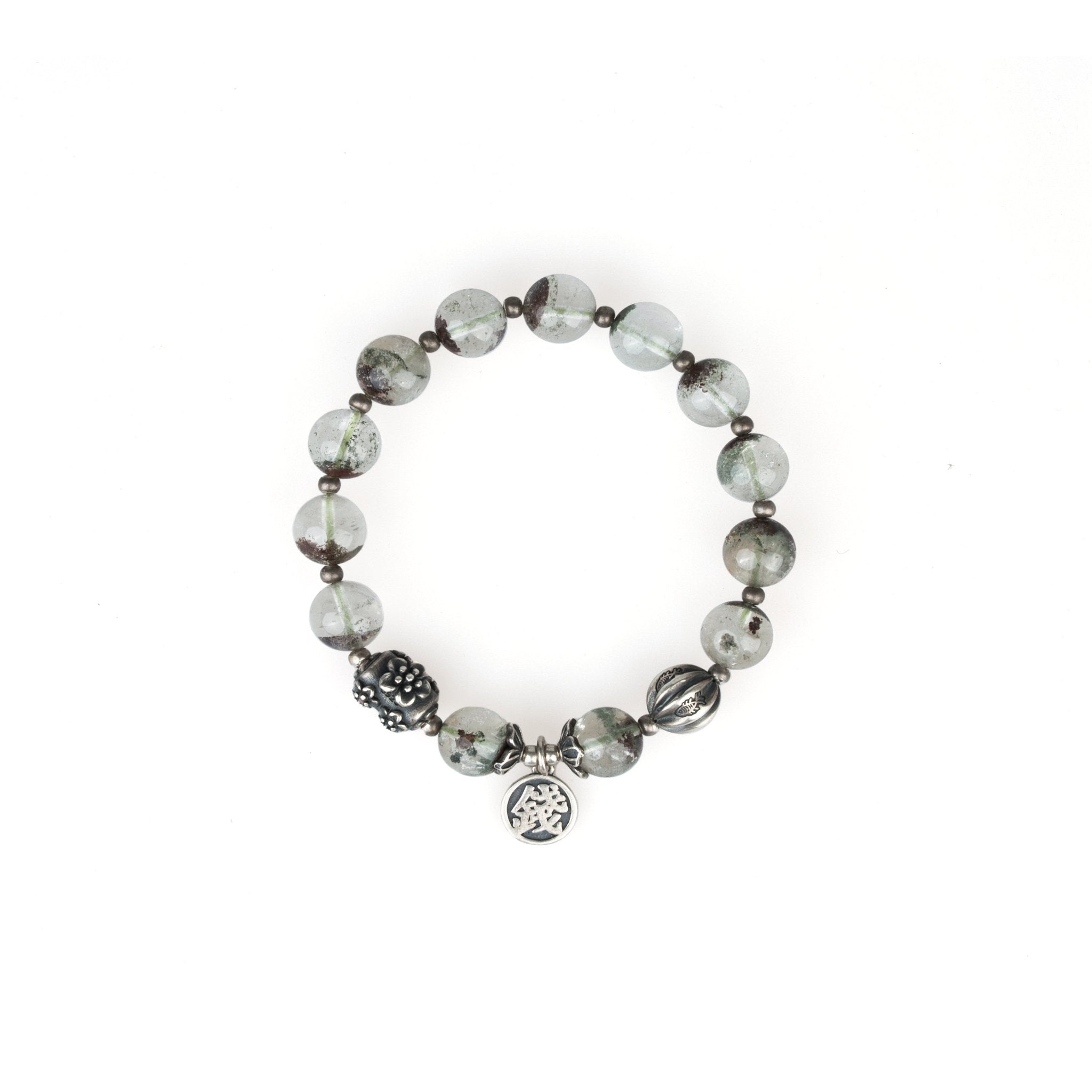 Round bead bracelet with gray stone beads and small silver charm dangle