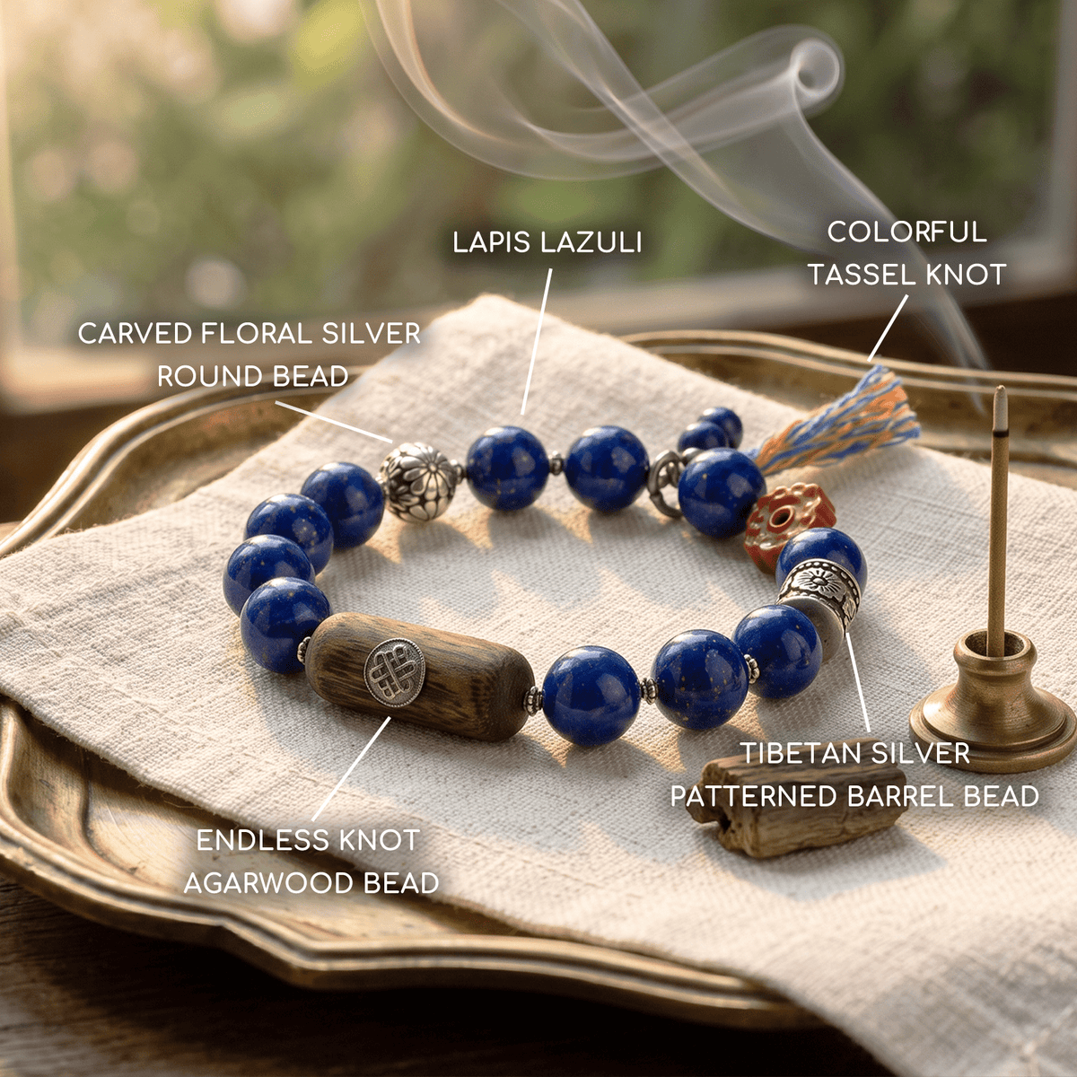 Tibetan lapis lazuli bracelet with carved floral silver bead, tassel knot, and blue barrel bead
