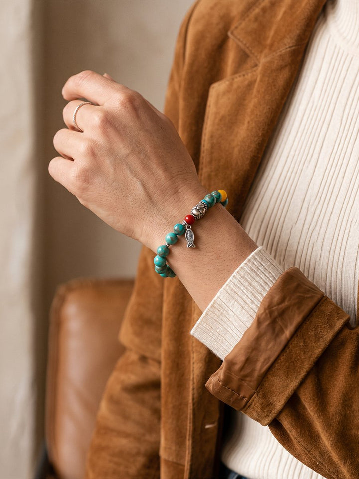 Woman Wearing the Turquoise Bracelet with a Camel Suede Blazer