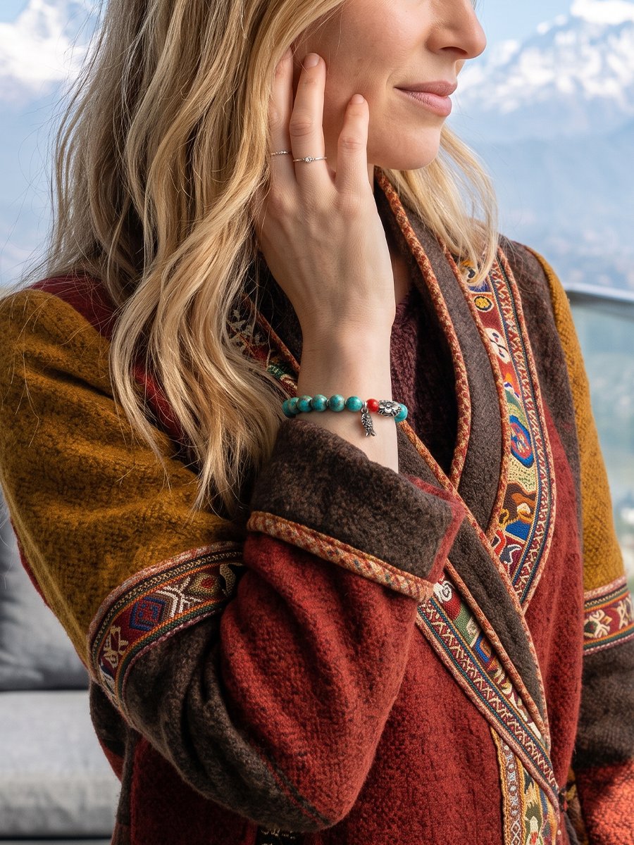 Woman Wearing the Mountain Blessings Turquoise Bracelet Against Snow-Capped Peaks