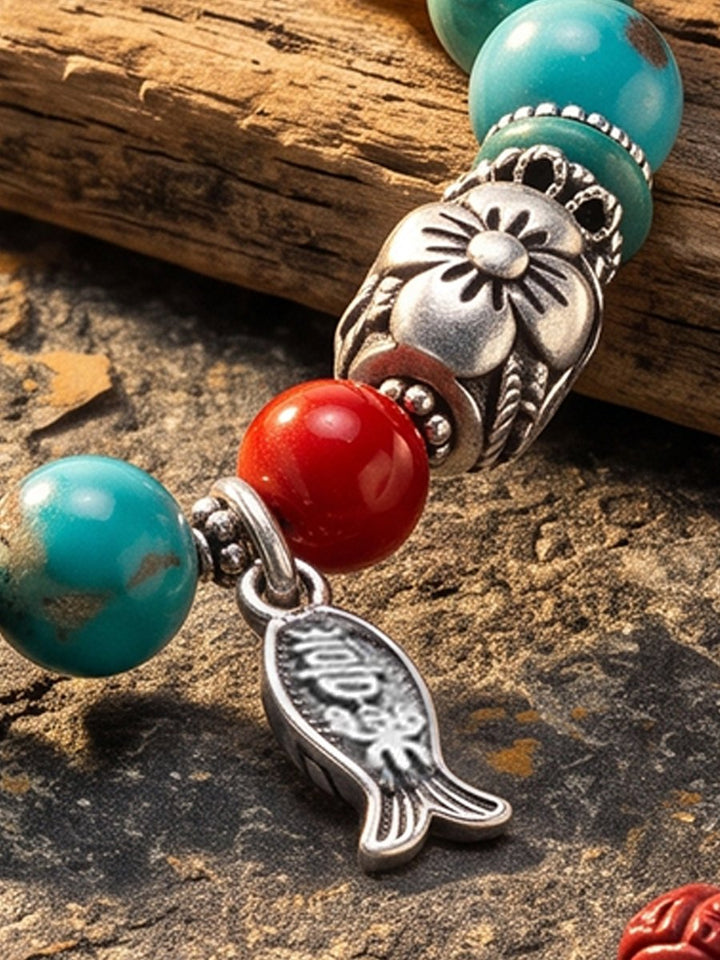 Turquoise, Cinnabar Red and Silver Lotus Bead Detail on Weathered Wood