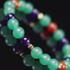 A close-up video of a handmade multi-gemstone bracelet for heart chakra healing, a meaningful gift for love and spiritual peace